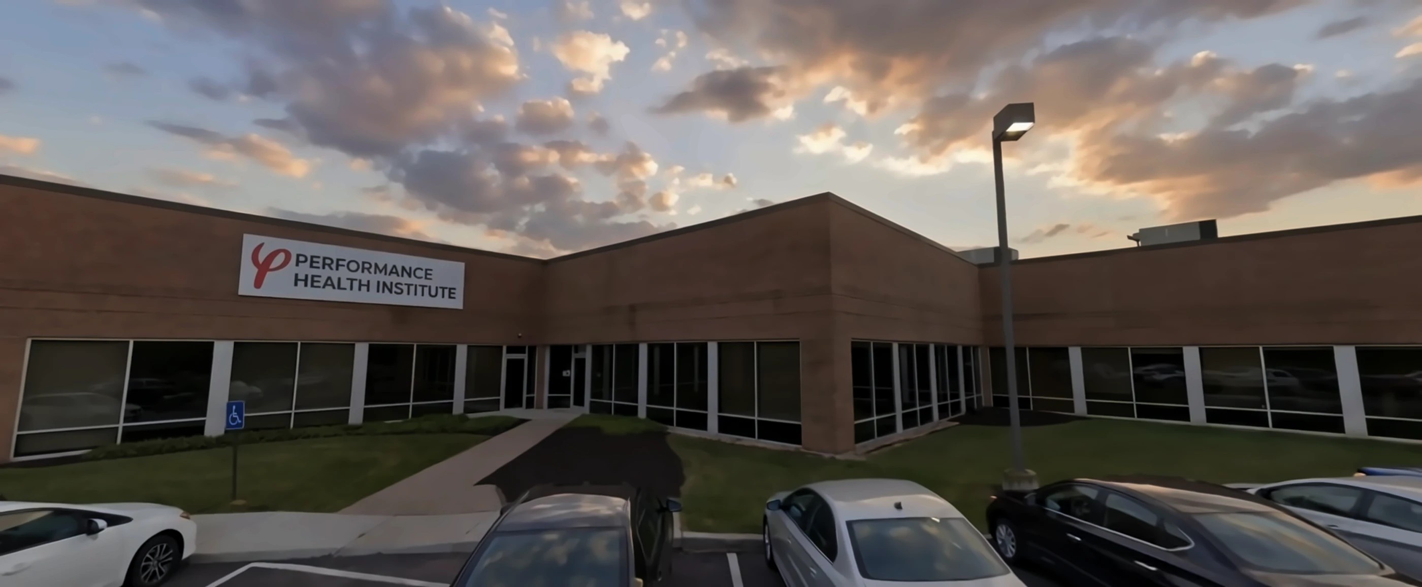 The Performance Health Institute building on Morrison Road at dusk
